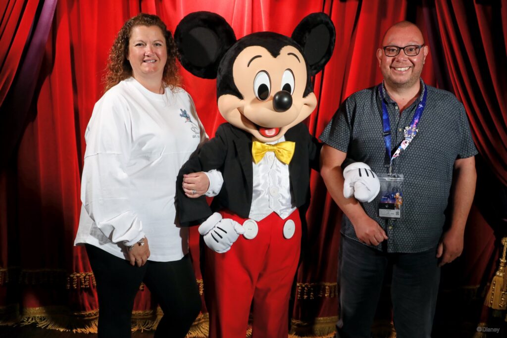 Mark and Janette Hartshorne with Mickey Mouse at Disneyland Paris — DLP Expert founders
